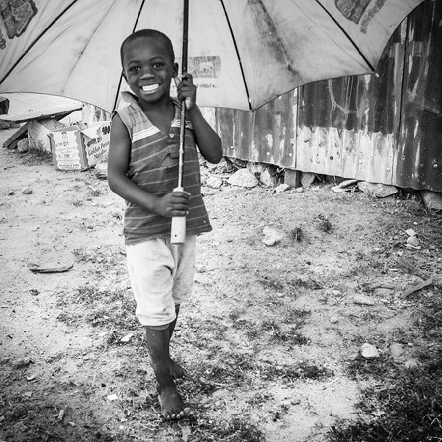 Summer Photograph - Just A Boy And His Umbrella, Nigeria by Aleck Cartwright
