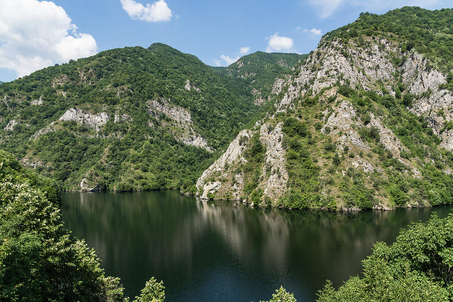 Juxtaposition - Rough Limestone Cliffs and a Peaceful Lake in the Mountains Photograph by Georgia Mizuleva