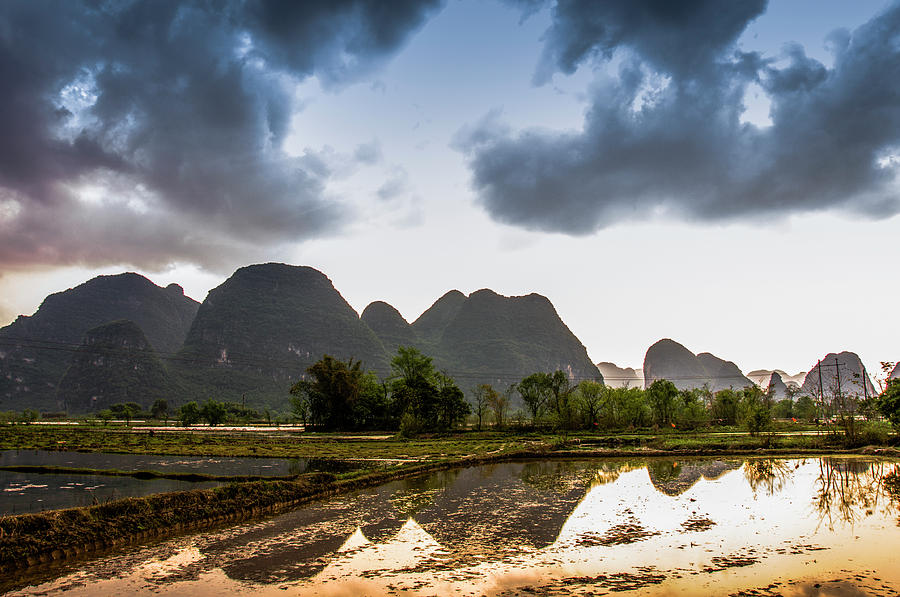 Karst mountains and rural scenery Photograph by Carl Ning