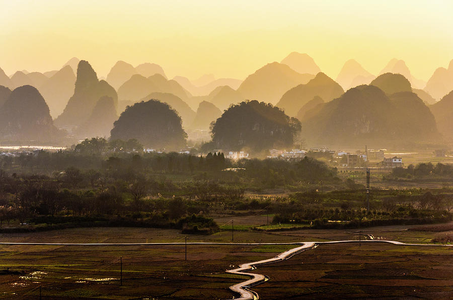 Karst mountains scenery in sunset Photograph by Carl Ning