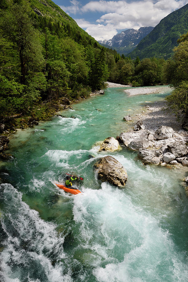 Triglav National Park Photograph - Kayaker shooting the cold emerald green alpine water of the Uppe by Reimar Gaertner