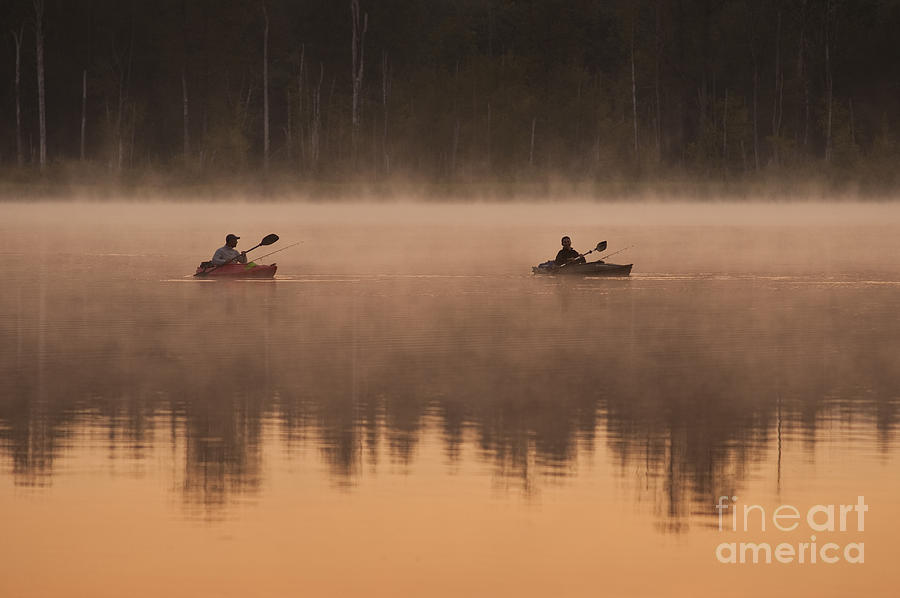 Kayakers fishing on Lake Cassidy Photograph by Jim Corwin