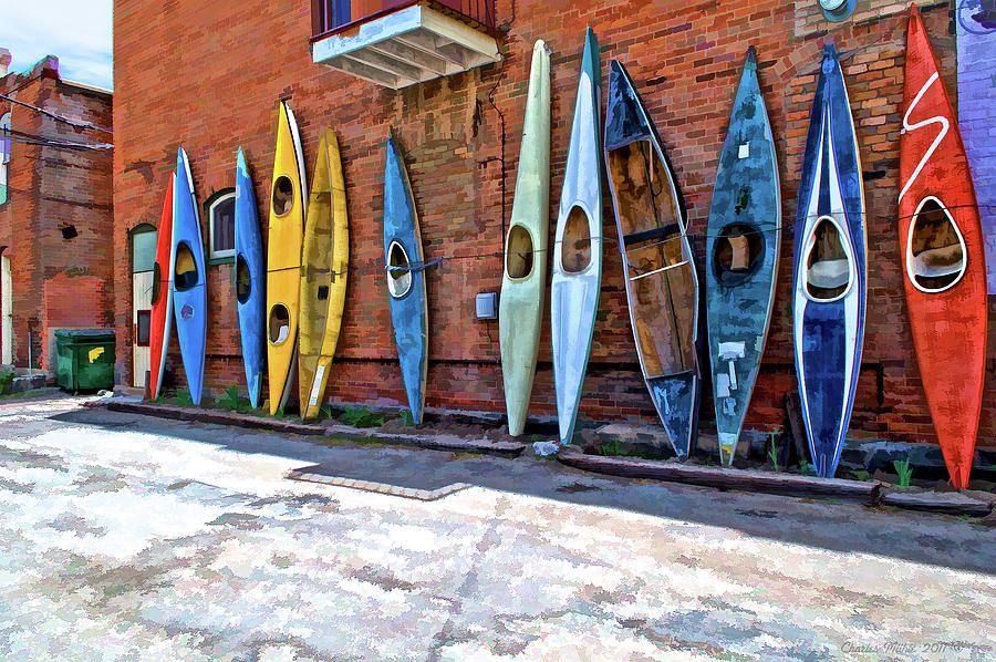 Kayaks on a wall  Photograph by Charles Muhle