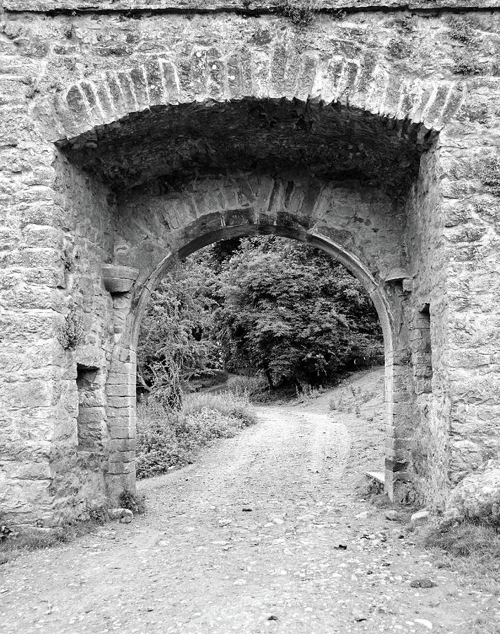 Kells Irish Priory Gatehouse and Dirt Road Path County Kilkenny Ireland Black and White Photograph by Shawn OBrien
