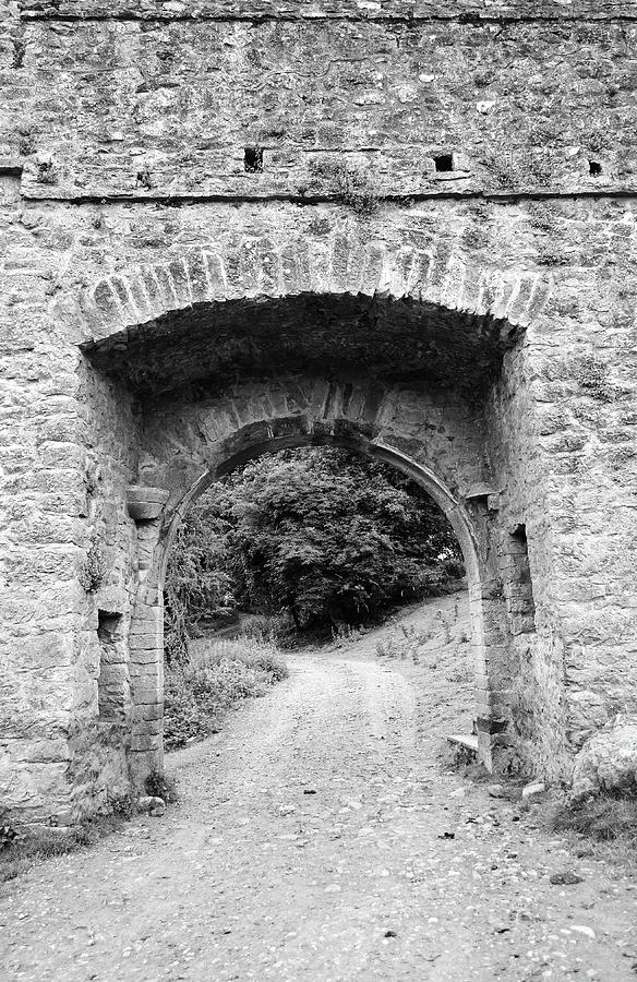 Kells Priory Gatehouse and Dirt Road Medieval Ruin County Kilkenny Ireland Black and White Photograph by Shawn OBrien