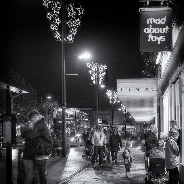 Christmas Photograph - Kissing At The Bus Stop, Gazing At The by Tobias King