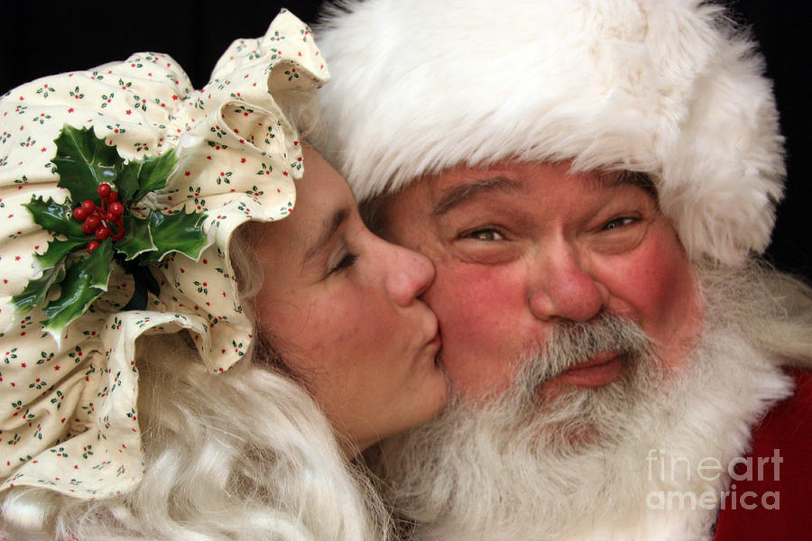 Kissing Santa Claus Photograph by Joanne Coyle