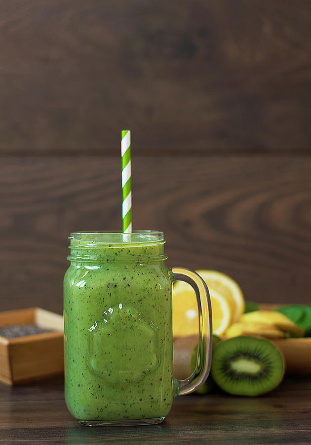 Kiwi healthy smoothie. Milkshake with kiwi, spinach, banana, lemon ...