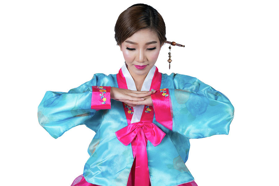 Korean lady in greeting action and Korea original dress with iso Photograph by Anek Suwannaphoom