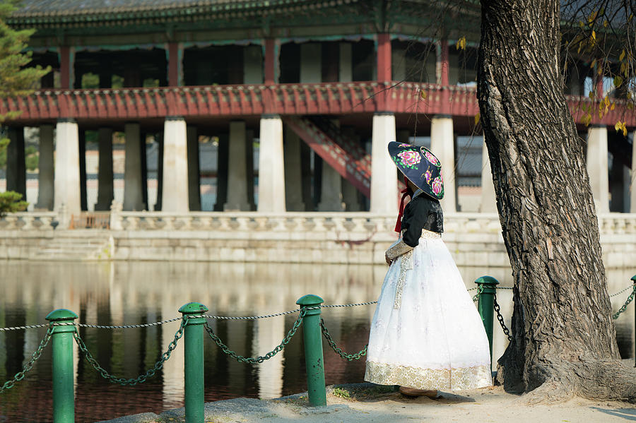 Korean lady in hanbok dress walk and travel in palace in Seoul city Photograph by Anek Suwannaphoom