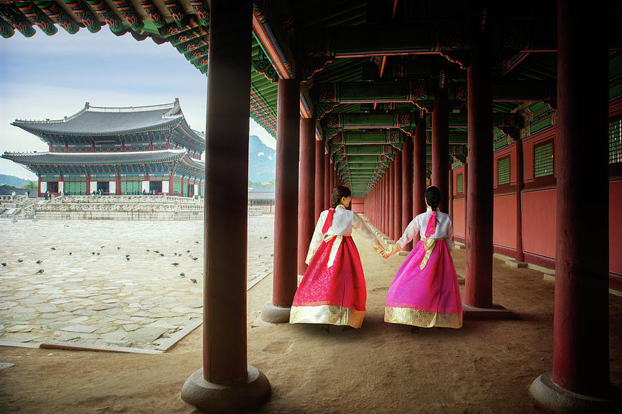 Korean lady in Hanbok or Korea gress and walk in an ancient pala Photograph by Anek Suwannaphoom