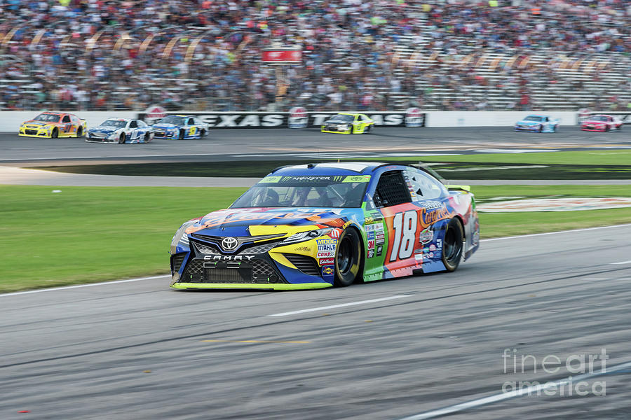 Kyle Busch coming in for a pit stop at Texas Motor Speedway Photograph by Paul Quinn