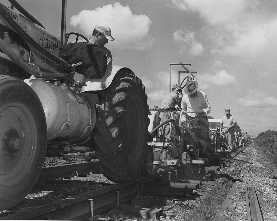 Laborers Work on Track With Heavy Machinery Photograph by Chicago and North Western Historical Society