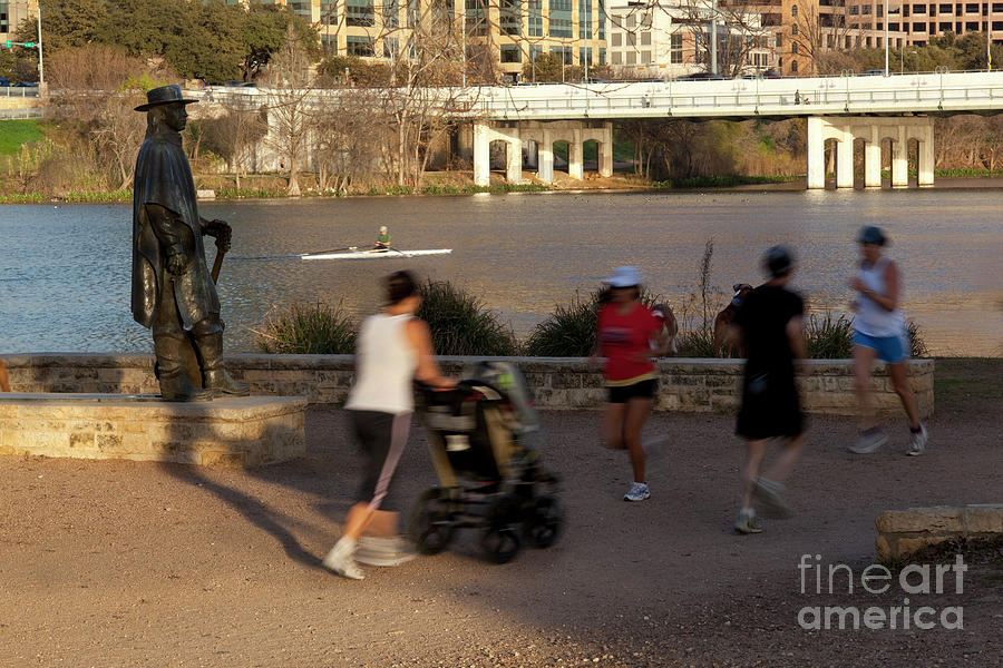 Austin Photograph - Lady Bird Lake hike and bike trail is a popular location for runners and kayakers to exercise along the Stevie Ray Vaughan Memorial Statue by Dan Herron