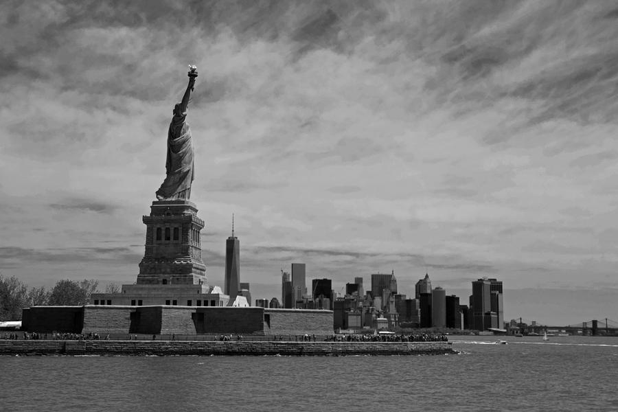 Lady Liberty overlooking New York City Black and White Photograph by Toby McGuire