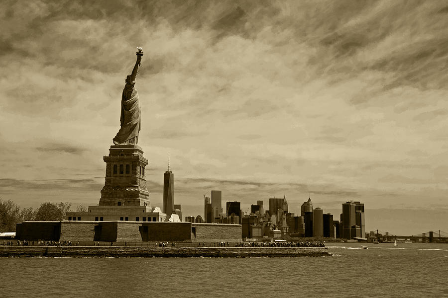 Lady Liberty overlooking New York City Sepia Photograph by Toby McGuire
