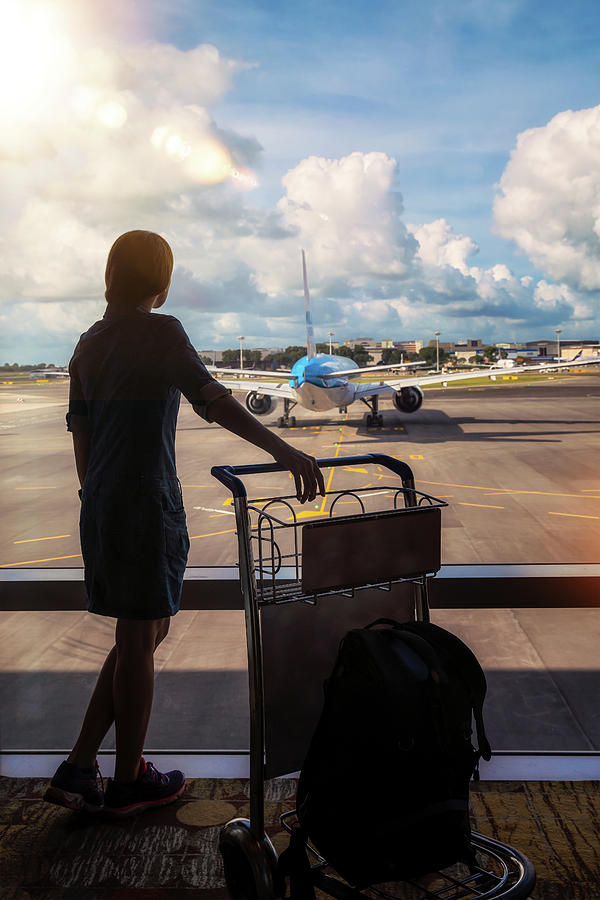 Lady Waiting Air Fright In Air Port Photograph by Anek Suwannaphoom