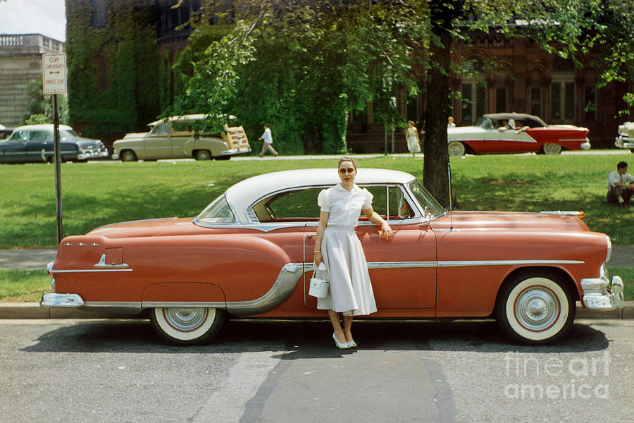 lady with her 1954 pontiac star chief 1950 s photograph by wernher krutein lady with her 1954 pontiac star chief 1950 s by wernher krutein