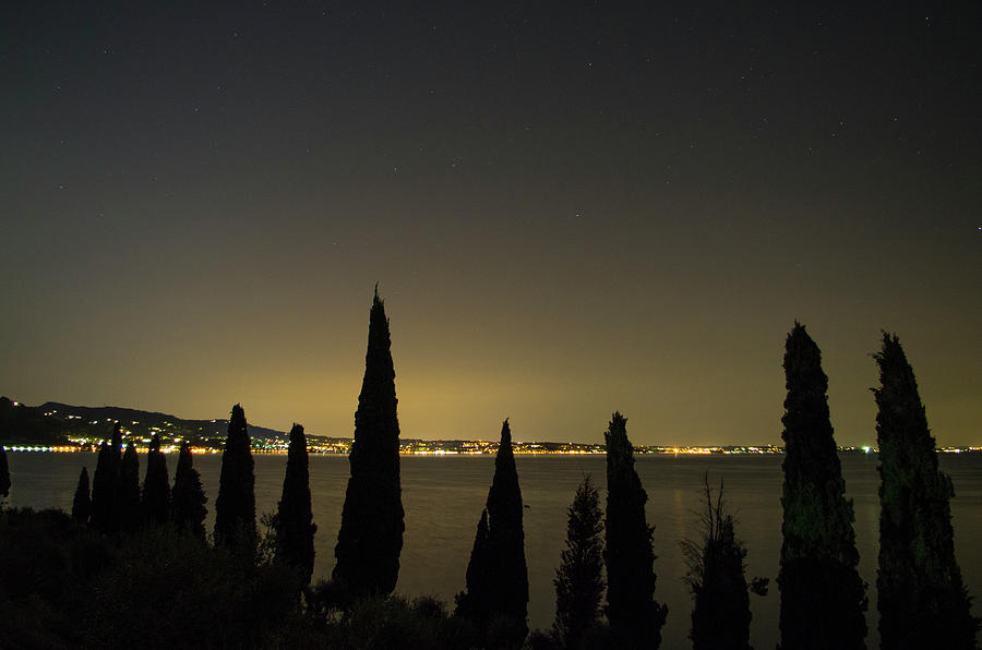 Summer Photograph - Lake Garda front at night by Nicola Aristolao