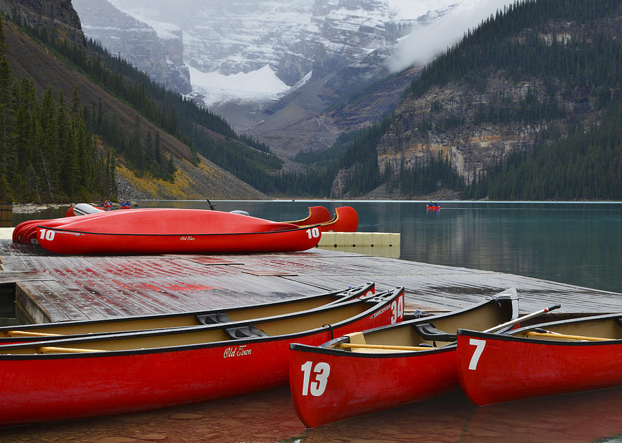 Lake Louise Canoes Photograph by Bill Cubitt