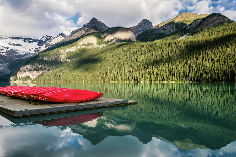 Lake Louise Canoes Photograph by Joan Carroll