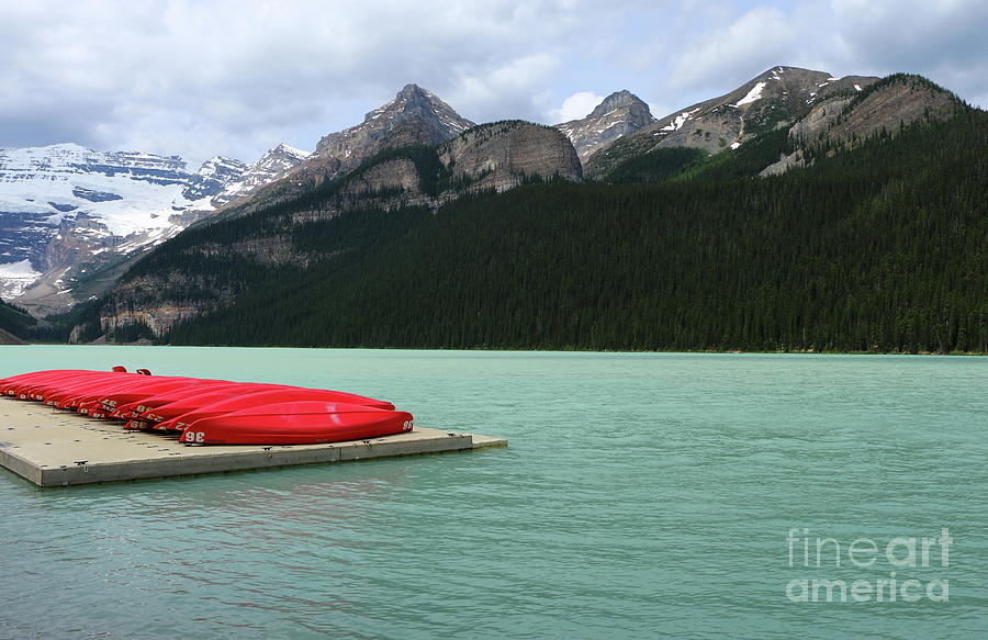 Lake Louise Red Canoes Photograph by Christiane Schulze Art And Photography