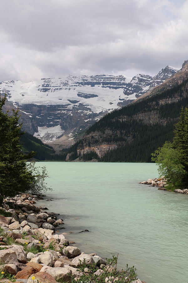 Lake Louise Under A Cloudy Sky Photograph by Christiane Schulze Art And Photography
