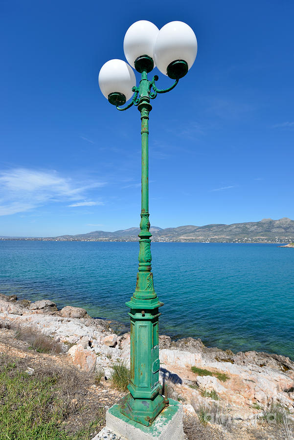 Lamp post by the seaside Photograph by George Atsametakis