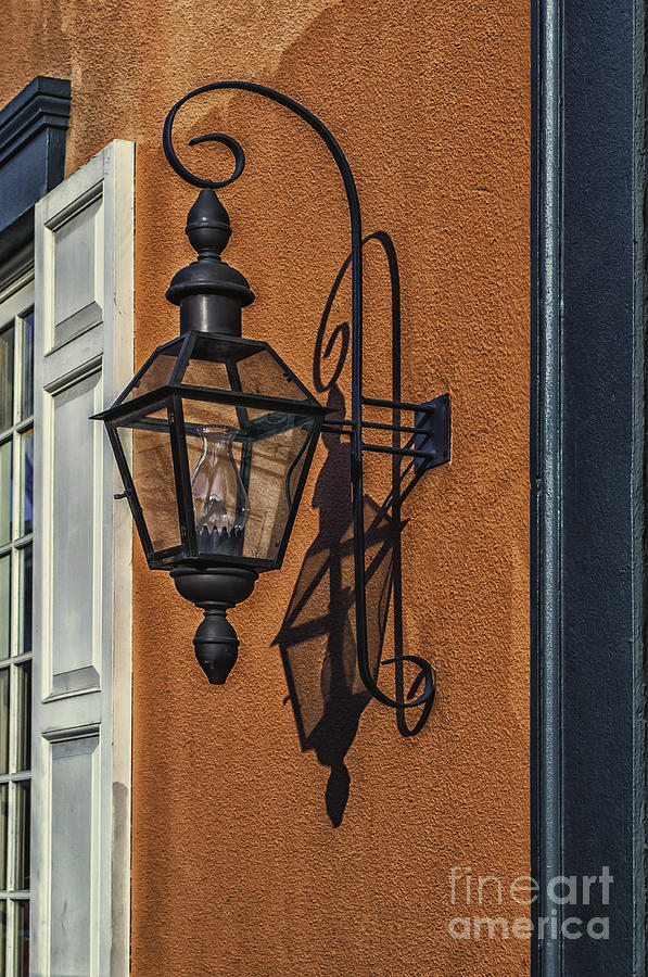 Lamp Post On Stucco Wall Photograph by Frances Ann Hattier