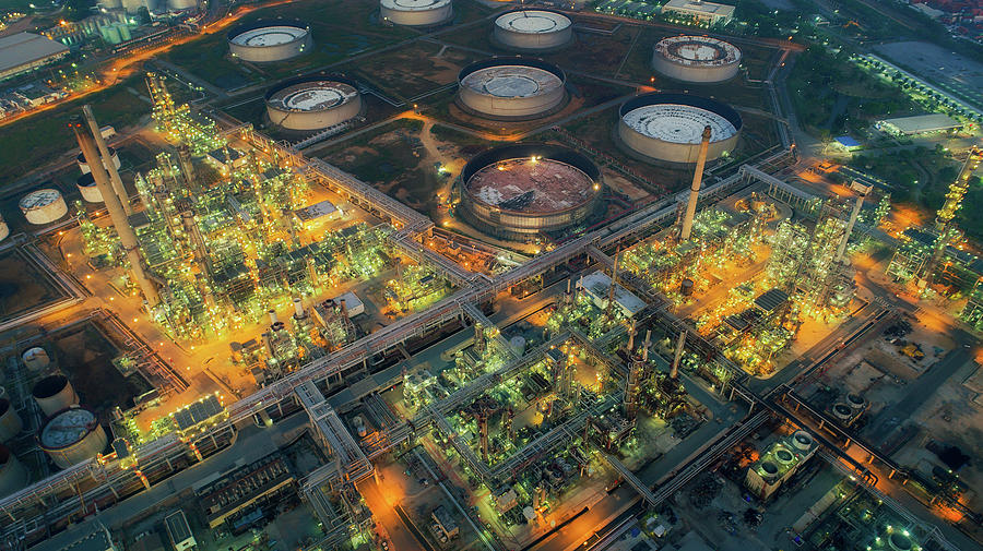 Land scape of Oil refinery plant from bird eye view on night Photograph by Anek Suwannaphoom