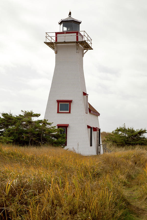 Landmark lighthouse, Prince Edward Island, Canada Photograph by Karen Foley