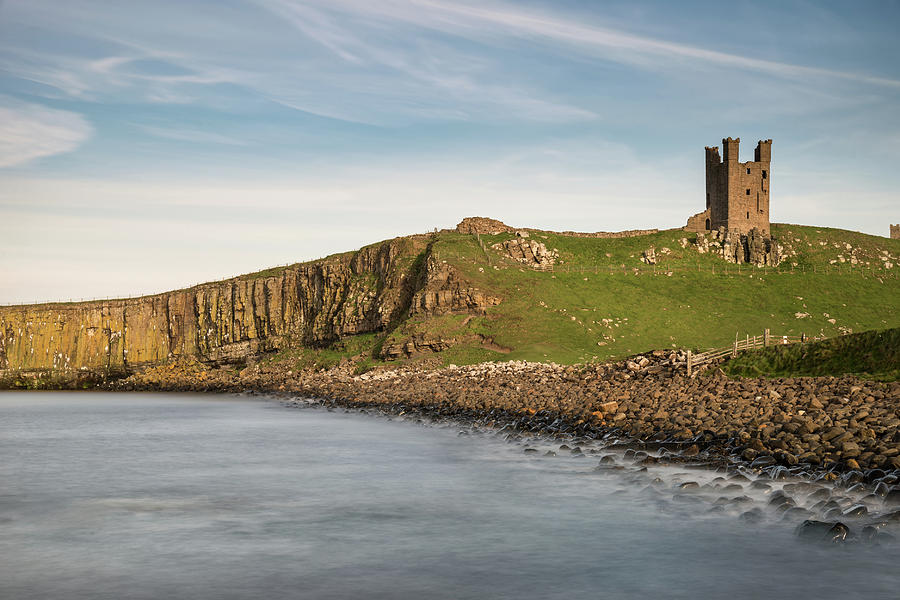 Castle Photograph - Landscape image of Dunstanburgh Castle on Northumberland coastli by Matthew Gibson