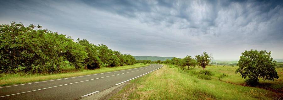 Landscape with highway and cloudy sky Photograph by Vlad Baciu
