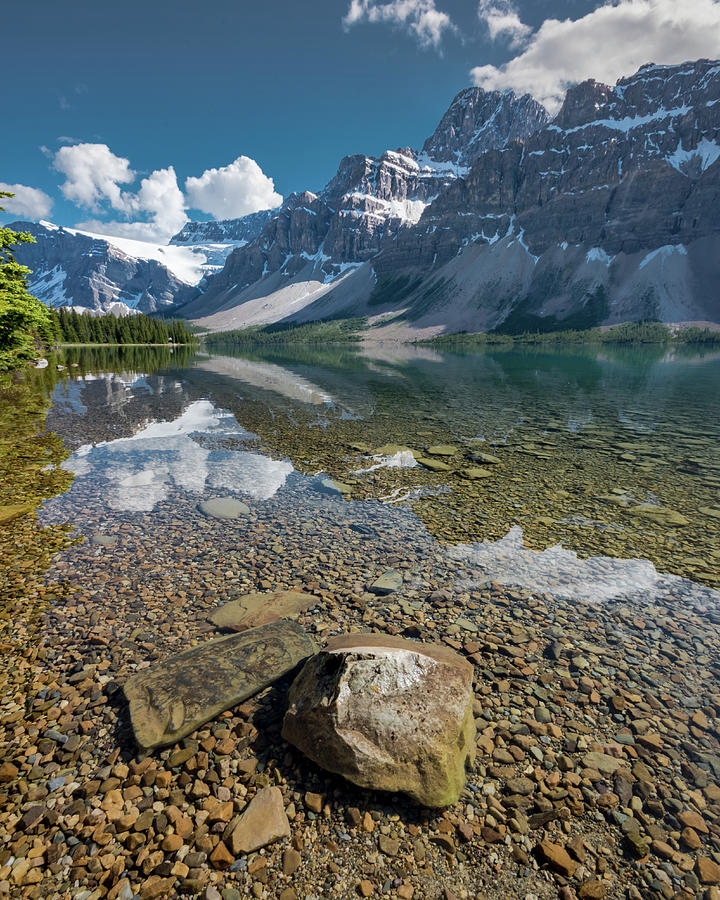 Large Rock Rises Above the Water At Bow Lake Photograph by Kelly VanDellen