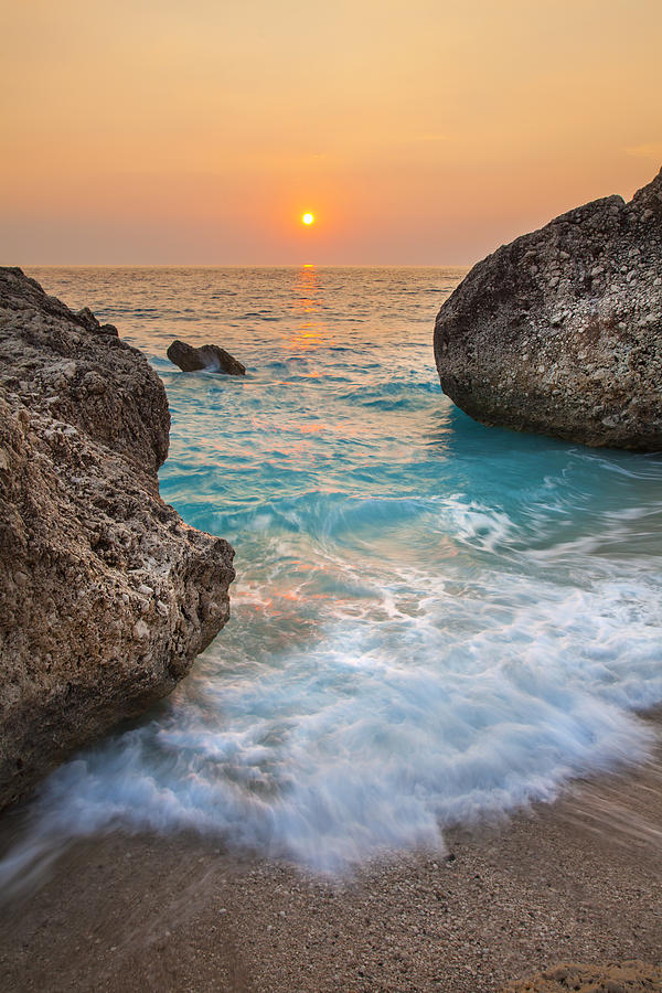 Holiday Photograph - Large rocks and wave with sunset on paradise island Greece by Sandra Rugina