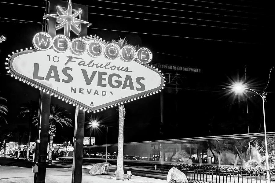 Black And White Photograph - Las Vegas Welcome Sign Lights in Black and White by Gregory Ballos