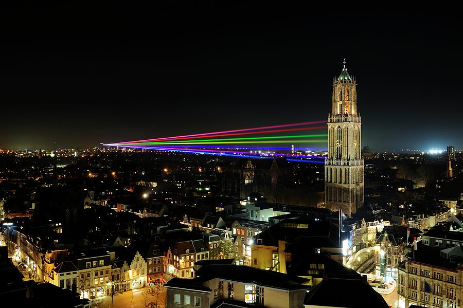 Laser beams on the Dom Tower in Utrecht 23 Photograph by Merijn Van der Vliet