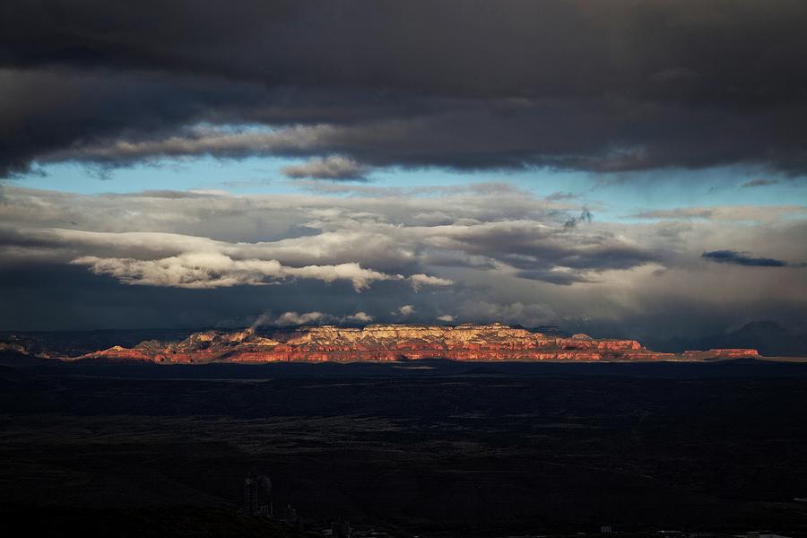 Late light on Red Rocks with storm clouds Photograph by Ron Chilston