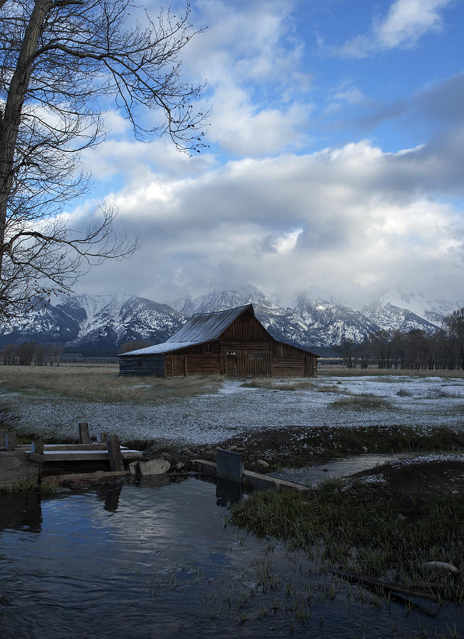 Yellowstone National Park Photograph - Late Snow on South Moulton barn by Gary Langley