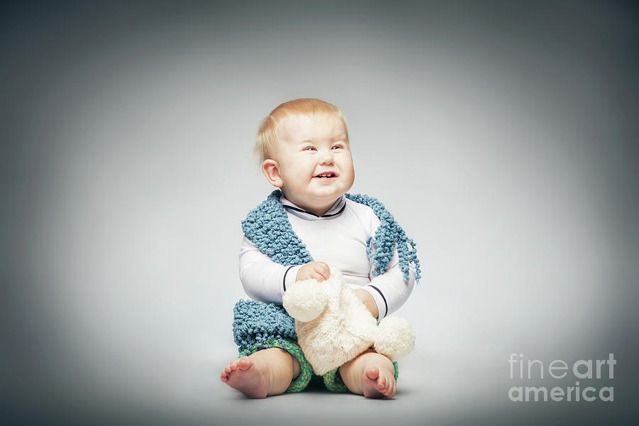 Laughing boy in pastel clothing. Photograph by Michal Bednarek