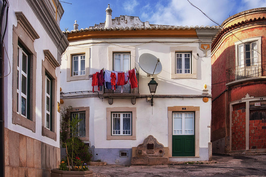 Laundry and architecture in Estoi, Portugal Photograph by Tatiana Travelways