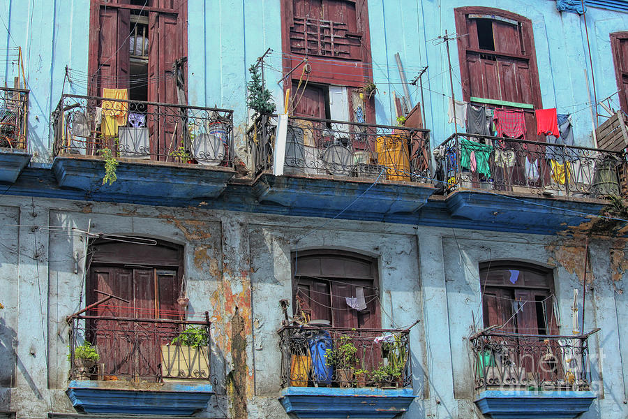 Laundry hanging from old houses in Cuba Photograph by Patricia Hofmeester
