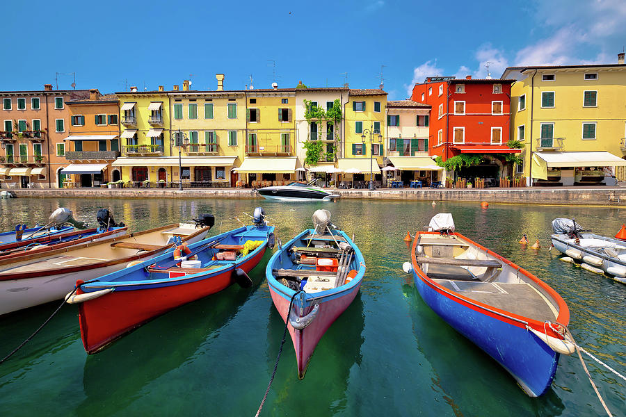 Lazise colorful harbor and boats view Photograph by Brch Photography