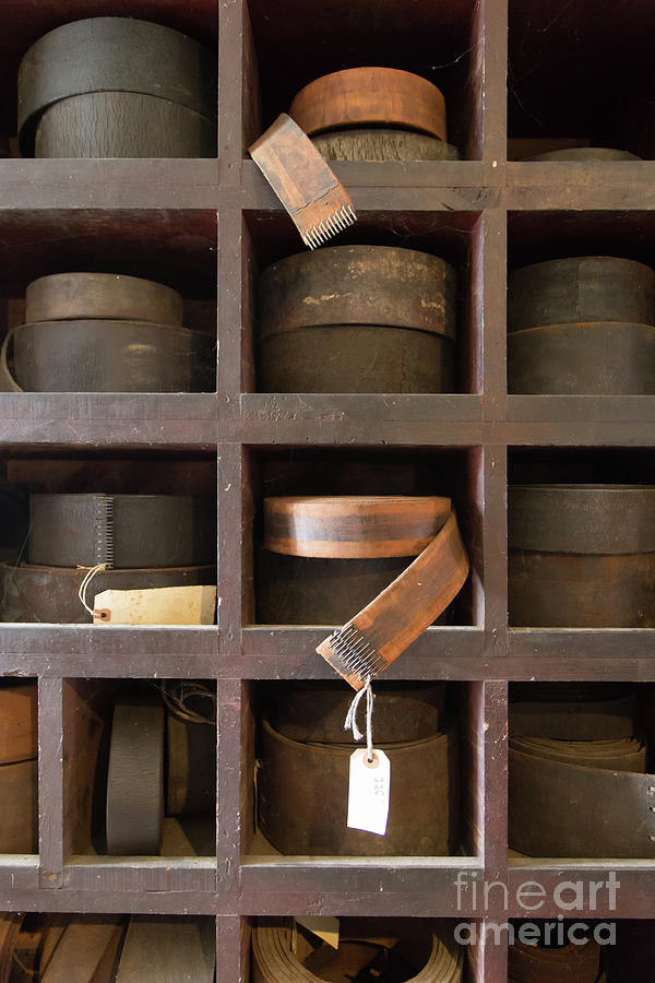 Leather belt storage at an old mill Photograph by Edward Fielding