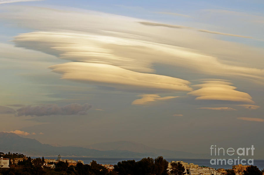 Lenticular clouds over Andalucia Photograph by Rod Jones