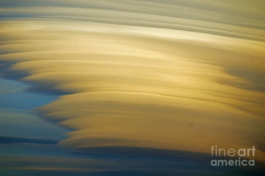 Lenticular clouds Photograph by Rod Jones