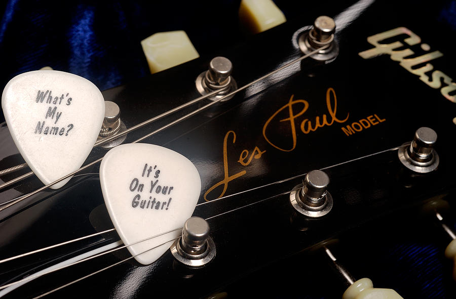 Les Pauls guitar pick on Gibson headstock by Gene Martin Photograph by David Smith
