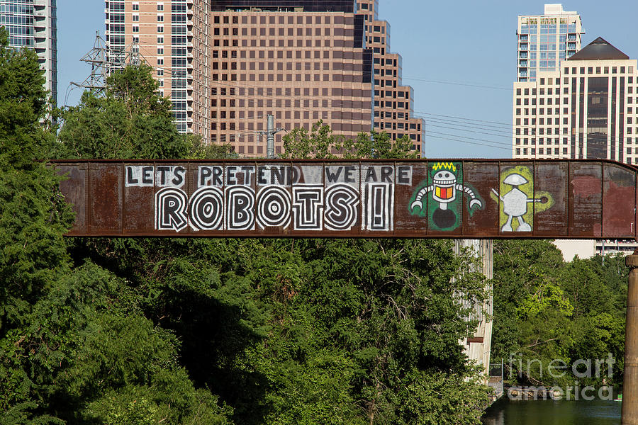 Austin Photograph - Lets Pretend We Are Robots is a famous graffiti painting on the by Dan Herron