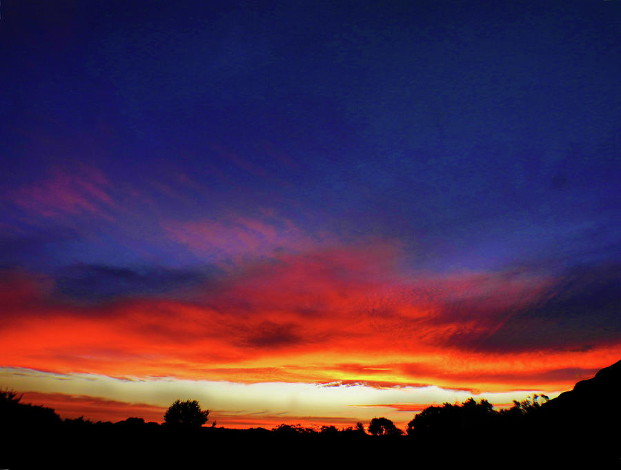 Levitating Sunset Photograph by Mark Blauhoefer