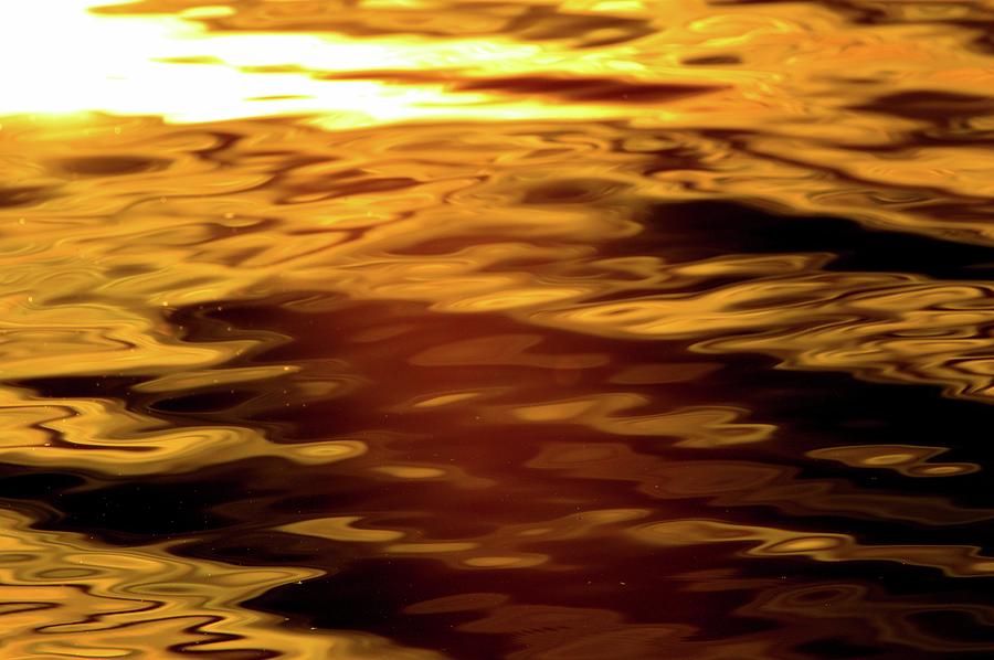 Light And Dark Yellow Patterns On Water  Photograph by Lyle Crump